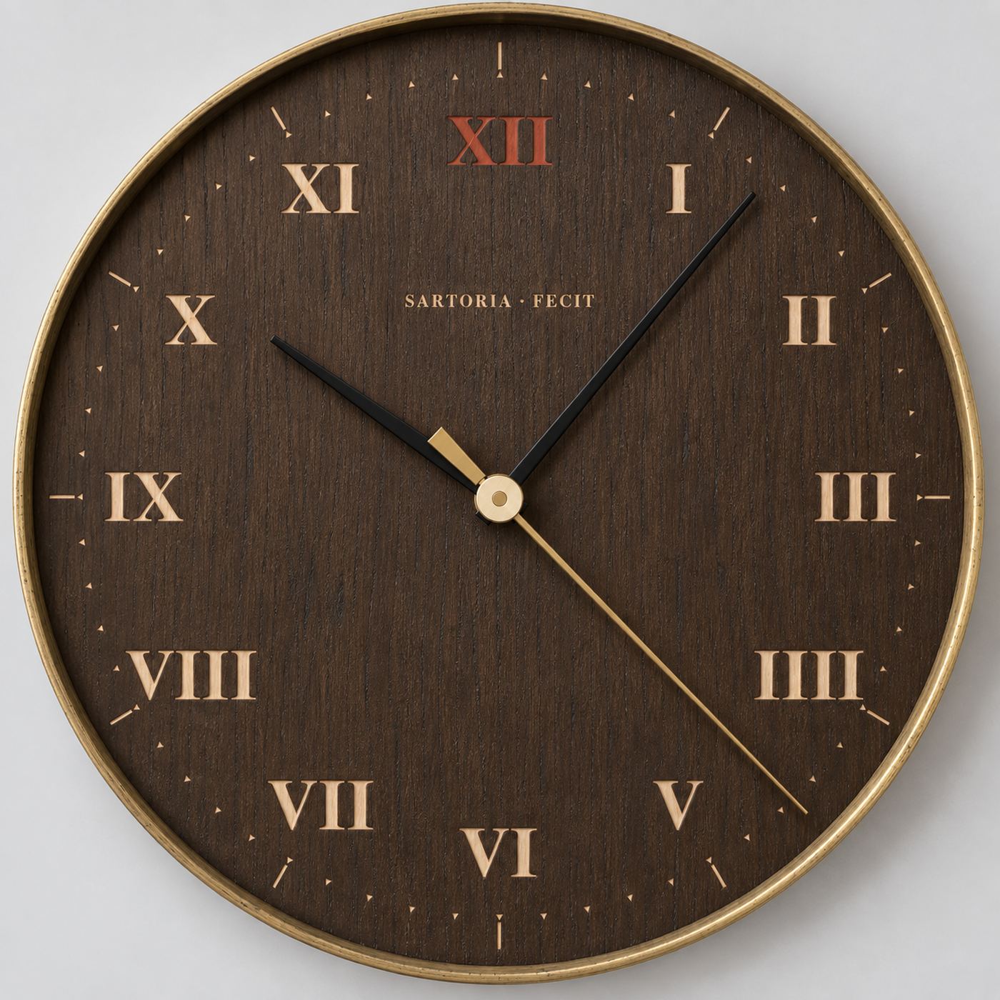 Mora, a spun brass wall clock with a fumed oak dial and pale Roman numerals, the twelve in red ochre.